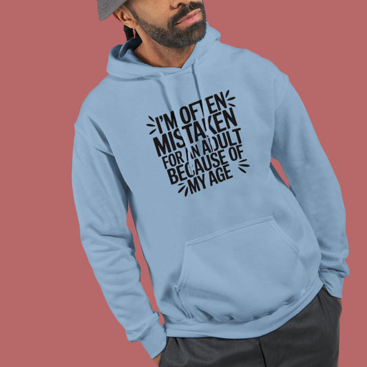 Man wearing a light blue hoodie that says "I'm often mistaken for an adult because of my age"