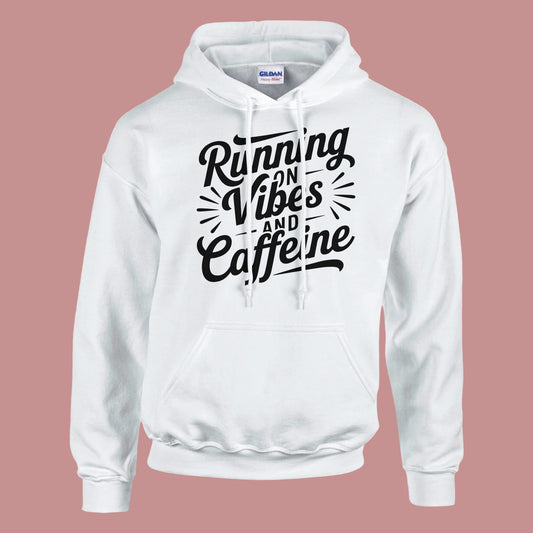 White hoodie with black text 'Running on Vibes and Caffeine' on a white background