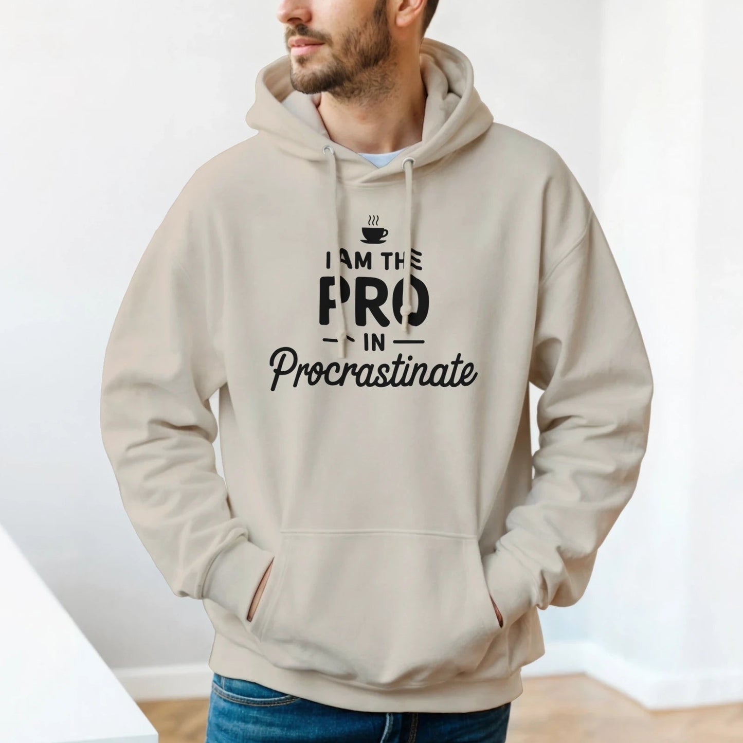 I am the Pro in Procrastinate pullover hoodie, minimalist black text, playful coffee cup icon, unisex casual