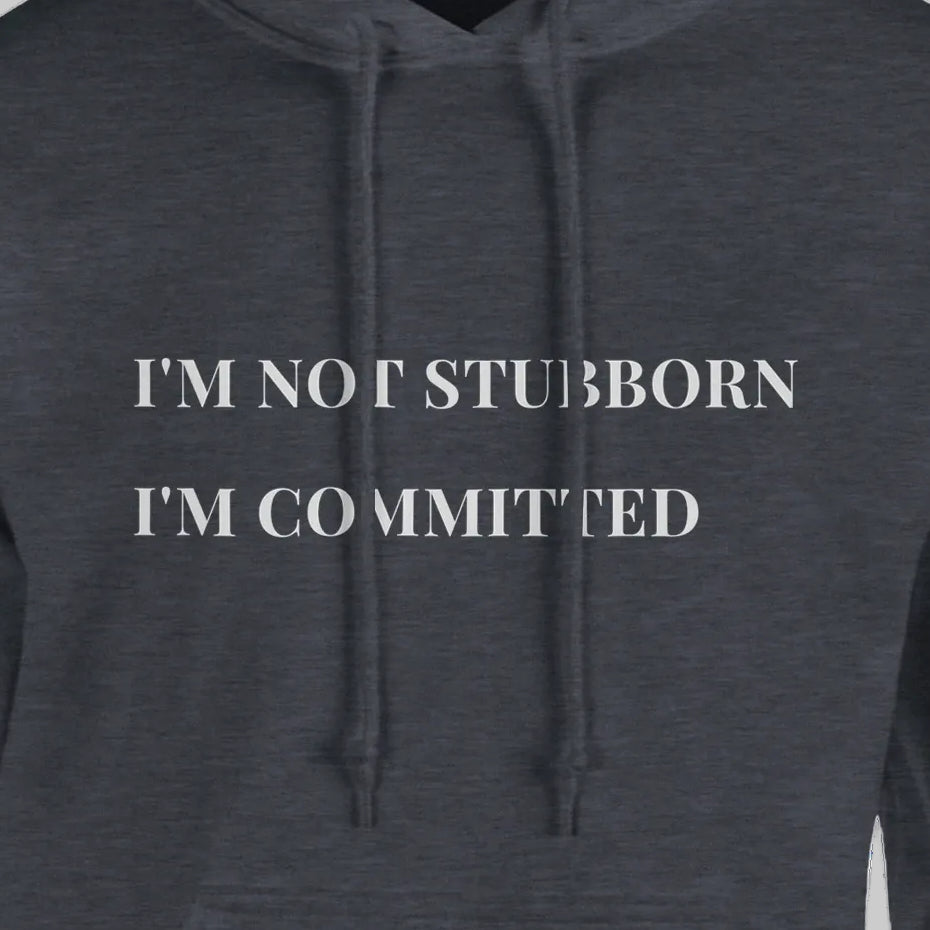 Unisex "I'm Not Stubborn, I'm Committed" hoodie worn by model, cozy fit with ribbed cuffs and kangaroo pocket, casual sweatshirt for funny sarcastic style