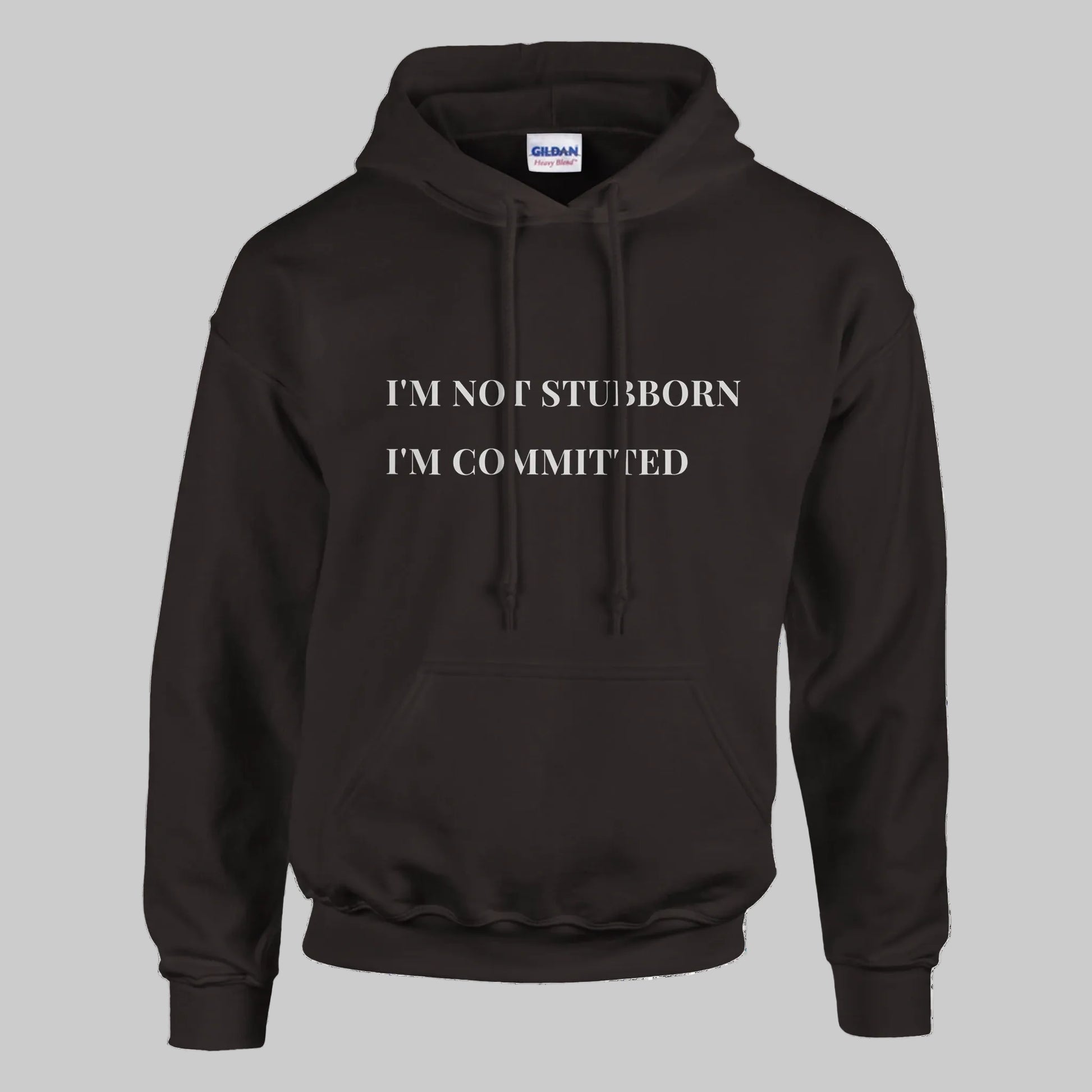 Unisex "I'm Not Stubborn, I'm Committed" hoodie worn by model, cozy fit with ribbed cuffs and kangaroo pocket, casual sweatshirt for funny sarcastic style