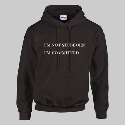 Unisex "I'm Not Stubborn, I'm Committed" hoodie worn by model, cozy fit with ribbed cuffs and kangaroo pocket, casual sweatshirt for funny sarcastic style