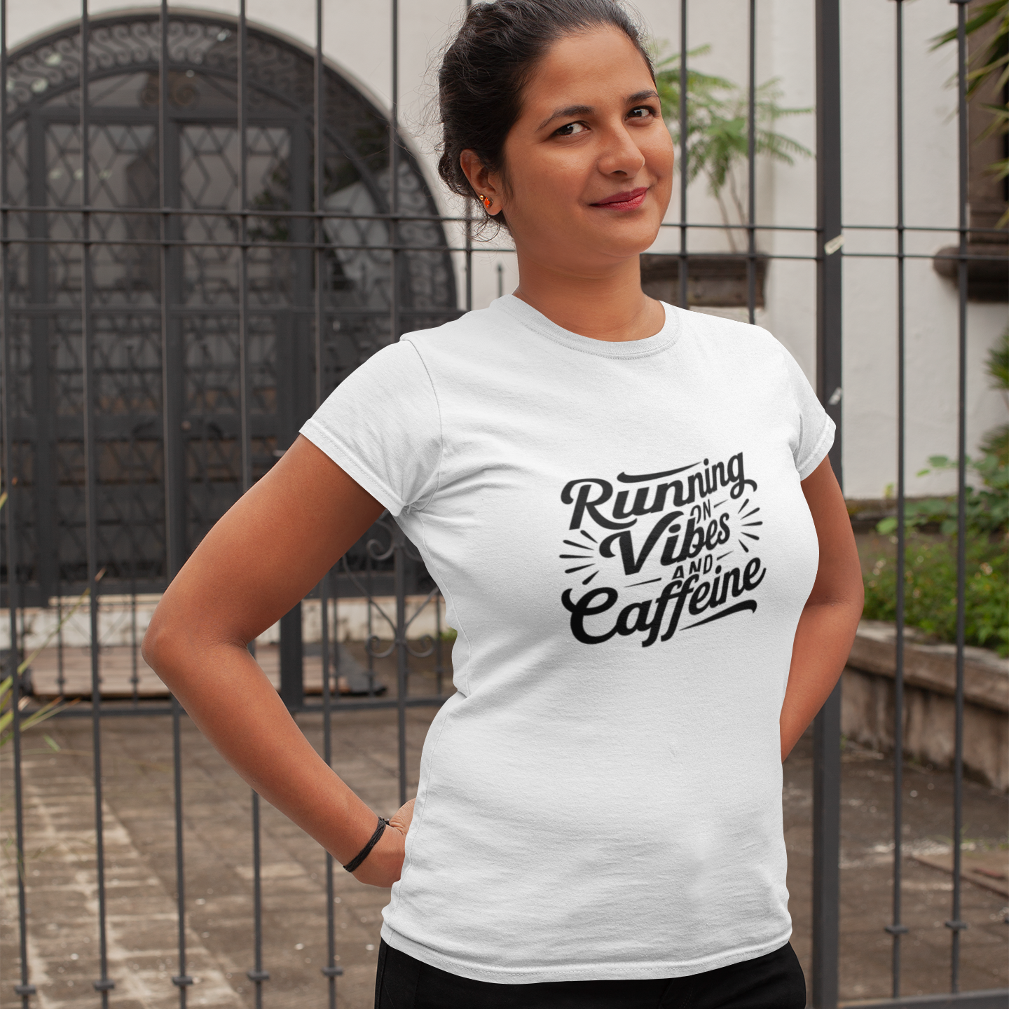 Women’s fitted “Running on Vibes” T-shirt, soft lightweight fabric, curved silhouette, light neutral color.